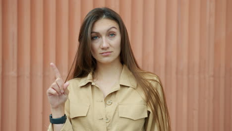 Woman in Beige Jumpsuit Pointing
