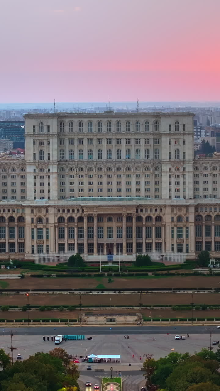 Aerial drone view of the Palace of Parliament in Bucharest, Romania at sunset. Vertical