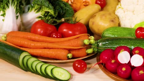 assorted vegetables displayed on a black background