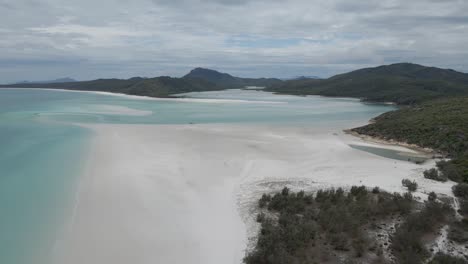 aerial view of whitehaven beach and hill inlet - popular tourist spot in whitsunday island, qld, australia