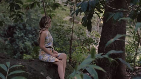 caucasian model enjoying a beautiful forest hike view in maui hawaii in slow motion.