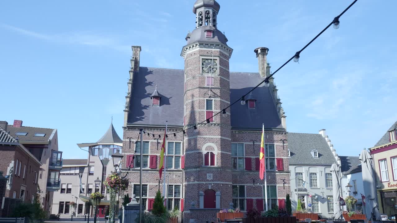 Building with Clock Tower and Flags