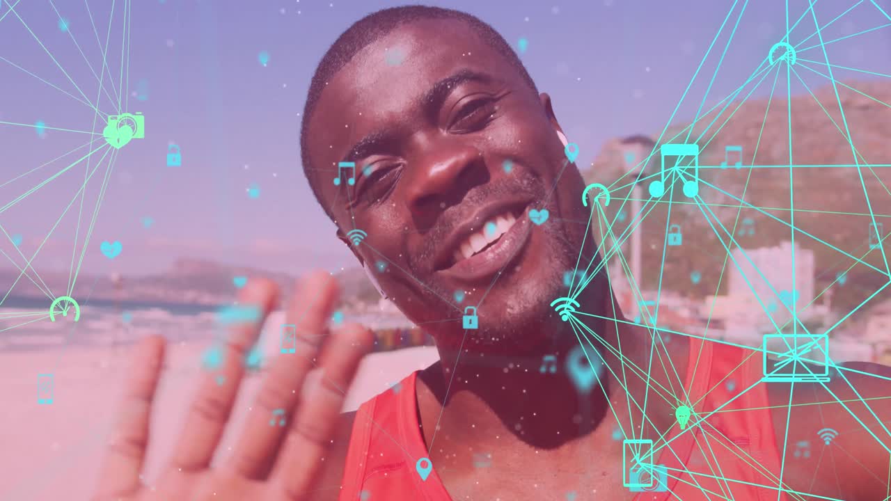 Globes of digital icons spinning against african american fit man waving looking at the camera