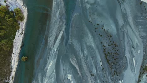 lowland floodplain glacial braided deposits lined by sandy banks meet lake wakatipu
