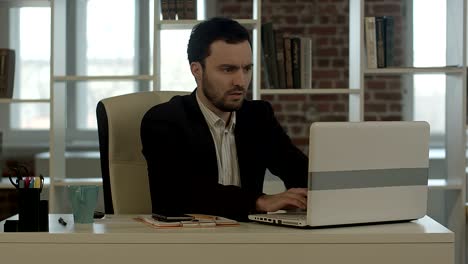 Businessman with laptop in crisis