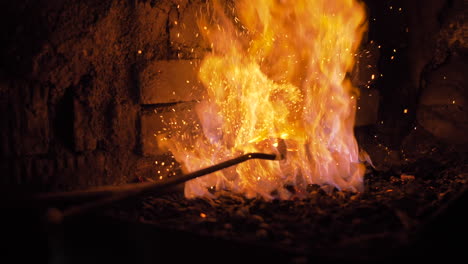 forging metal in a fiery blacksmith workshop