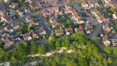 Chafford-gorges-nature-park-near-residential-houses-on-a-sunny-day,-aerial-view