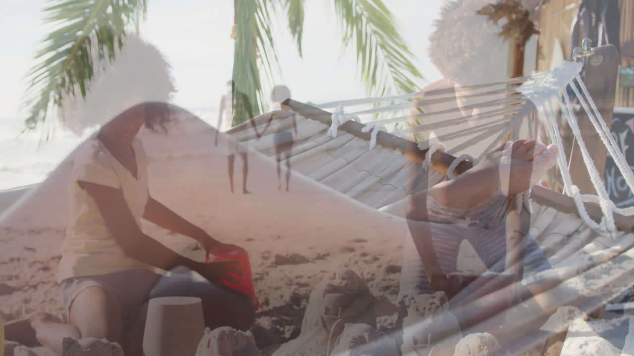 Girl kneeling building sandcastle under palm tree, travel ads overlaying animated red bucket icons