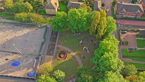 Children-Playing-At-Playground-In-The-Park-In-Sheffield,-United-Kingdom