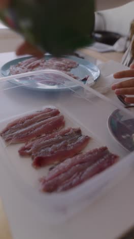 preparing sliced anchovies