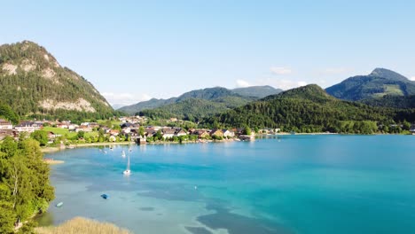 Fuschl-Am-see-establishing-aerial-shot,-rising-reveals-serene-lake-town,-Austria