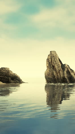 calm sea with rocks in the background