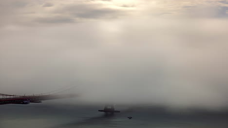 timelapse of clouds and fog moving around the bay bridge in san francisco