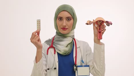 female doctor explains reproductive health with uterus model and contraception