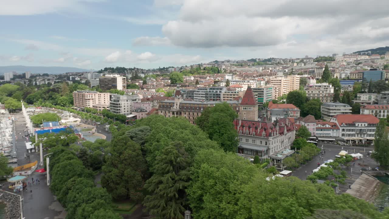 Drone orbitting Chateau d'Ouchy in downtown Lausanne, Switzerland