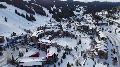 Drone-aerial-views-of-Copper-Mountain,-CO-on-a-sunny-afternoon-in-the-winter