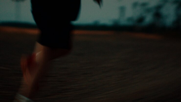 Blurry Silhouette of Person at Night