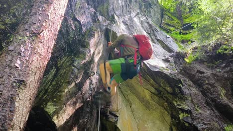 slow-motion shot of hikers exploring ferrata hans kammerlander in alta badia, dolomites, italy, dramatic mountain scenery and rocky paths as they climb up chains