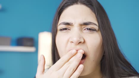 Young-woman-with-aching-teeth-has-braces.