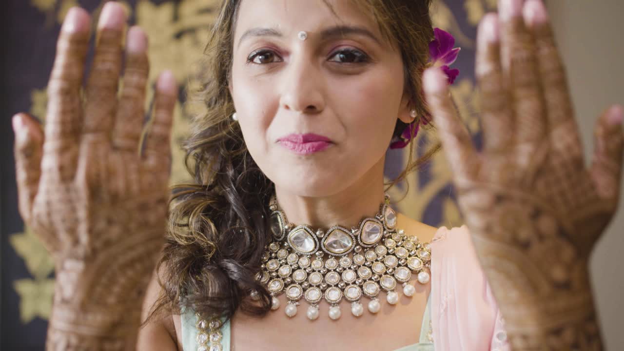 Bride's Forearms Drawn With Beautiful Mehndi Design Revealing