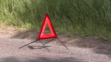 the warning emergency triangle standing on the road