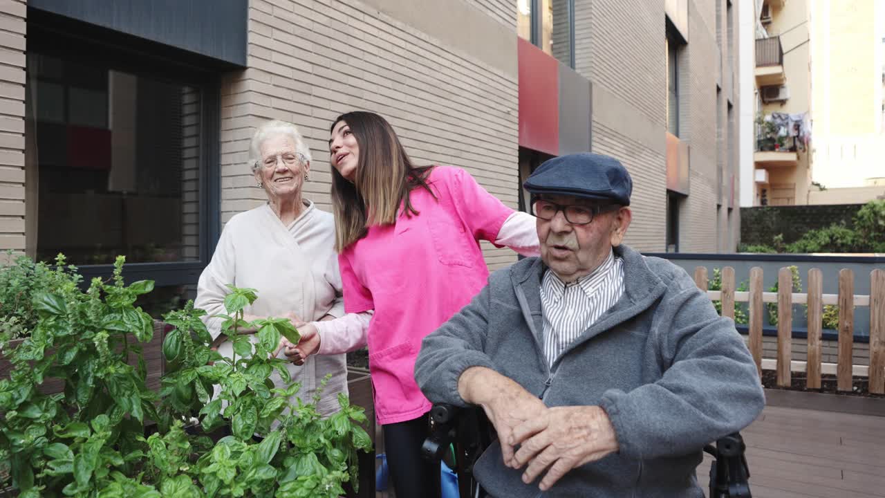 Seniors and caregiver in a garden setting