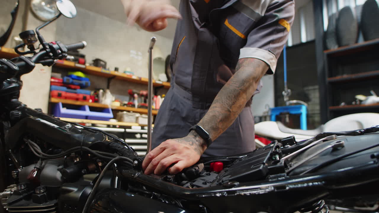 Mechanic Using Valve Adjusting Wrench for Motorbike Repairing