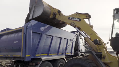 excavator loading dump truck