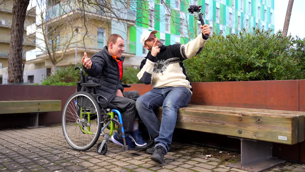 Two friends enjoying a day out vlogging while one uses a wheelchair