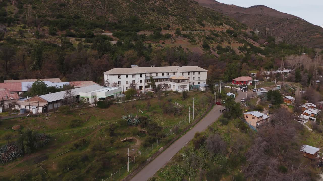 Old building on a hillside in a rural mountain landscape