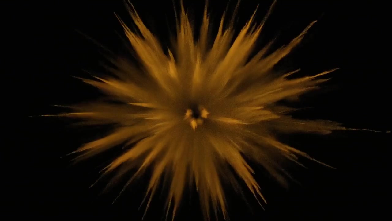 Golden Powder Explosion on Black Background