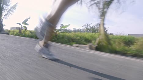 woman jogging along road