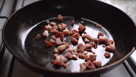 Cooking-Diced-Bacon-On-Frying-Pan-In-The-Kitchen