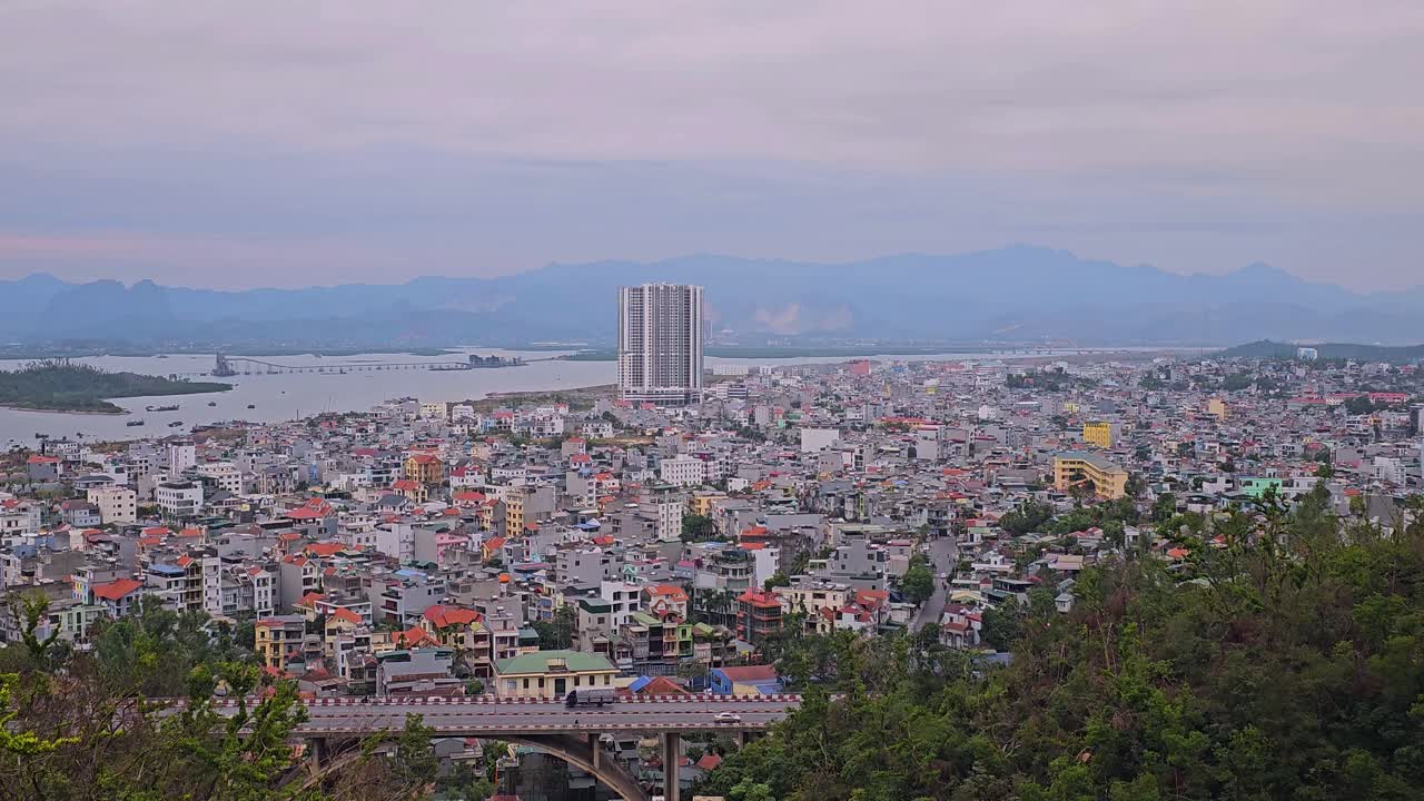 Ha Long City Houses And Buildings With Cua Luc Bay In Vietnam. - zoom in shot