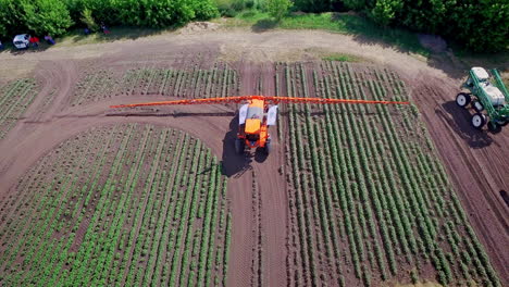 agricultural sprayer fertilizing plant on farming field. agriculture irrigation