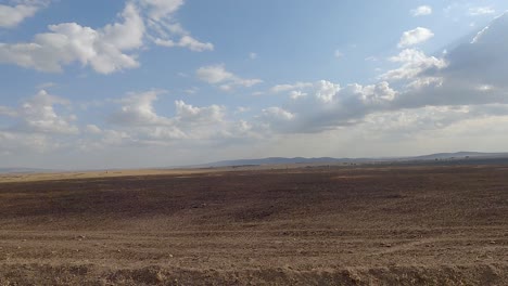 barren land in maasai mara national reserve from a car in kenya, africa