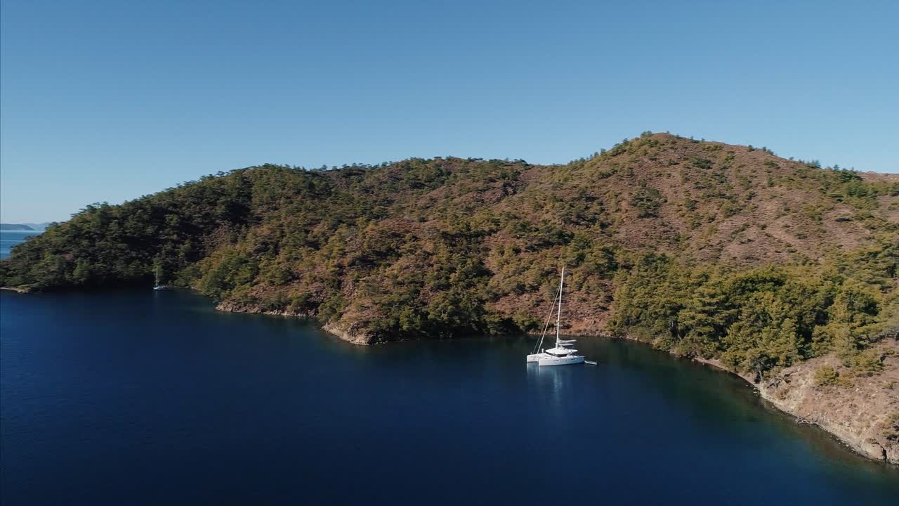 Catamaran at Anchor in a Secluded Bay