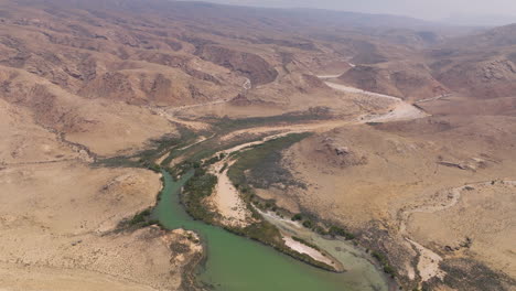 panorama of arid mountains near the island beach of shoab in qalansiyah, yemen