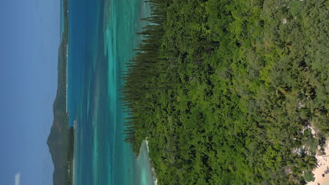 Aerial-low-altitude-pull-back-revealing-amazing-Ilot-Moro-and-Isle-of-Pines-in-the-background