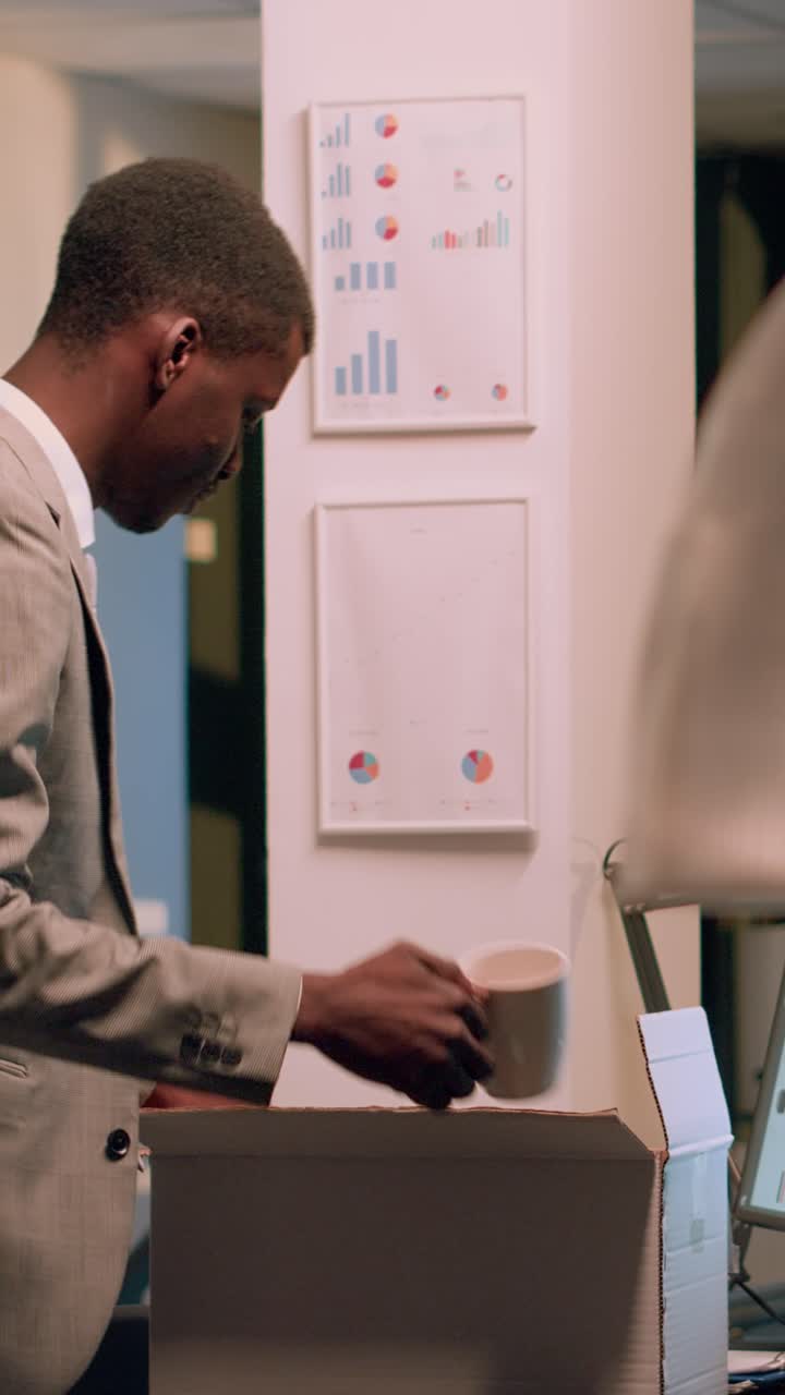Vertical video Employee packing desk belongings