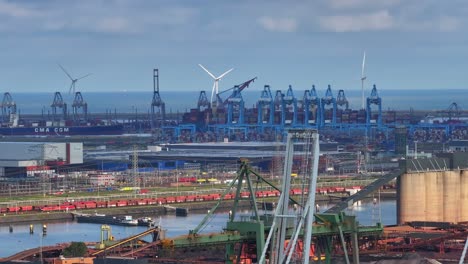 wind turbines rotating in distance. maasvlakte, rotterdam, netherlands