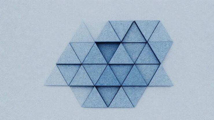 Animating tile motion showing hexagonal cluster of blue triangular prisms dissolving on studio wall