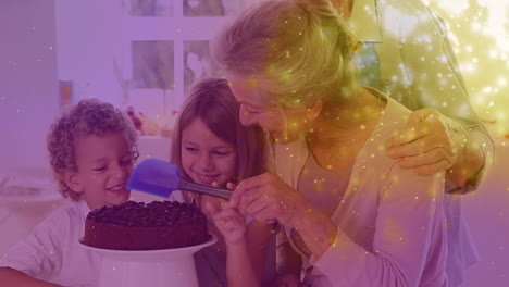 animation of sparkles over happy caucasian grandparents and grandchildren making cake