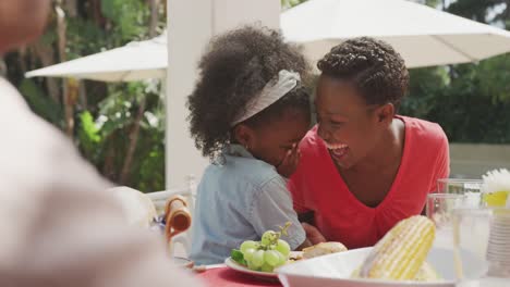 happy family eating together at table
