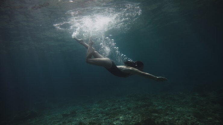 Woman Freediving Underwater