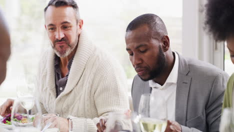 Diverse-and-mature-group-of-friends-eating