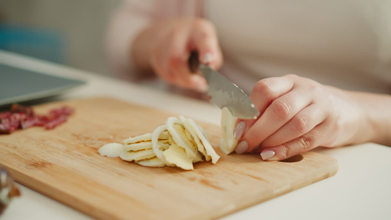 Woman chopping hard-boiled eggs