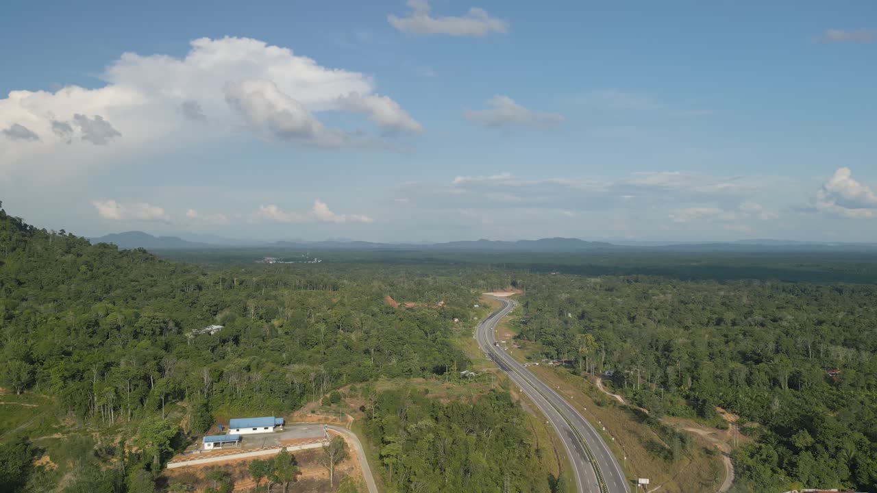 Beautiful Borneo Rain forest,On The Way From Lundu To Biawak With Green Tall Trees And Gading Mountain Background,Borneo,Malaysia
