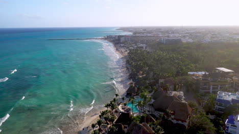 cinematic drone shot of playa del carmen coastline and resorts