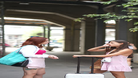 two women talking at an airport